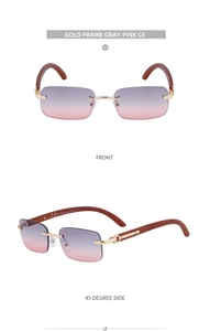 Detail of rimless gold frame sunglasses with gray-pink gradient lenses and wood grain arms