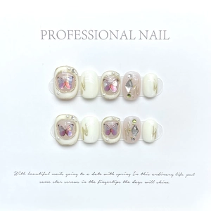 Baroque butterfly press-on nails with pearls and rhinestones on minimalist white background