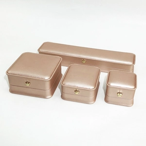 Detailed set of rose gold PU leather jewelry boxes with elegant crown metal buckles