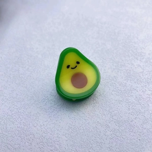 Macro view of cute 3D avocado shaped acetate hair clip with detailed resin texture