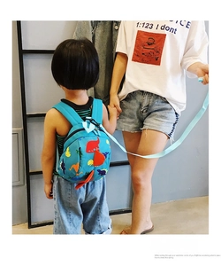 Blue dinosaur toddlers backpack featuring safety harness leash for kids outdoors
