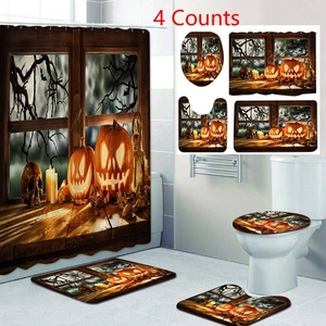 Detail view of 4-piece Halloween bathroom set with pumpkin and skull print on shower curtain