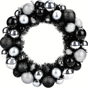 Christmas wreath with black and silver ornaments in glossy, matte, and glitter finishes