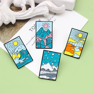 Set of four seasonal landscape enamel pins featuring waves, mountains, snow, and canyons