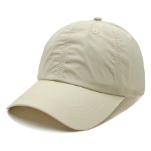 Detailed view of the wrinkled nylon texture on the beige contrast knot headband