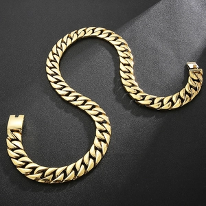 Close-up of high-polish gold Cuban link chain with detailed metal interlocking links