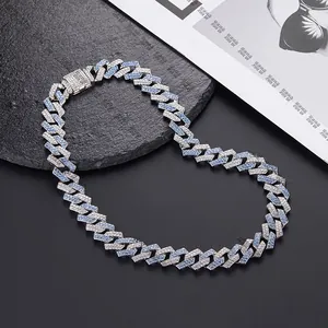 Detail of 15mm hip hop Cuban link chain with blue and white crystals on black stone