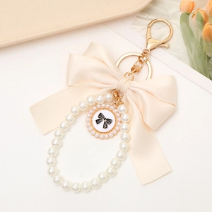 Elegant pearl bow keychain with number 5 pendant for phone cases and headphones