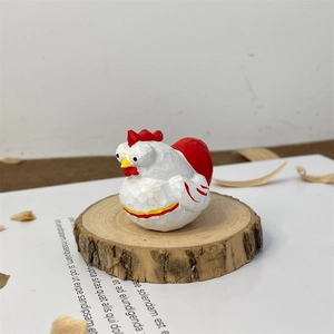 Macro detail of hand-carved wooden chicken figurine with artisan texture on wood base