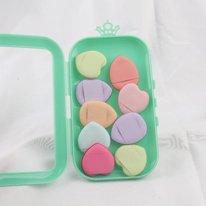 Set of 8 colorful heart and teardrop finger puffs in a green crown storage box
