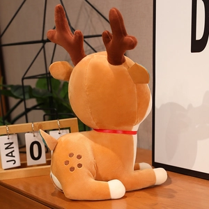 Plush brown reindeer toy with red collar in a cozy home setting, side-back view