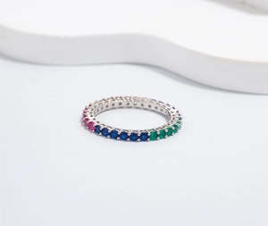 Macro shot of 925 silver ring featuring a full band of colorful 4mm 5A cubic zirconia stones