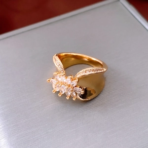 Close-up of 18K gold plated flower ring with sparkling marquise zircon crystals