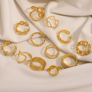 Detailed stack of 18K gold plated rings featuring hollow stars and heart zircon motifs