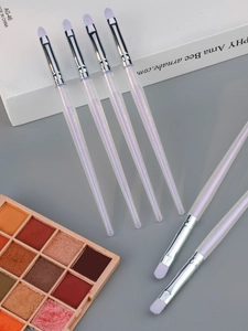 Detail view of 6 makeup brushes with sparkling purple handles and soft synthetic bristles