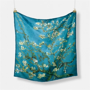 Detail of square silk scarf featuring Van Gogh's Almond Blossoms with blue floral patterns