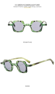 Detail view of punk square sunglasses with green flower marble texture and light grey lenses