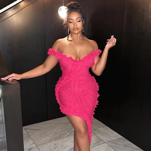 Detail of pink off-shoulder dress featuring tiered ruffles and asymmetric hemline