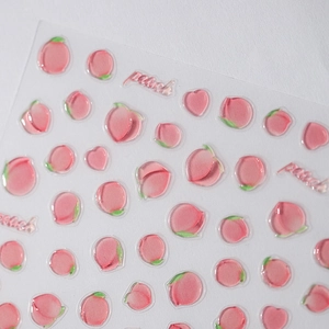 3D peach adhesive nail stickers with clear resin jelly texture on white background