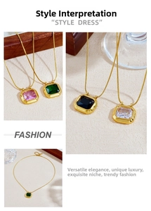 Detail of vintage geometric pendant necklaces with colorful zircon stones on gold snake chains