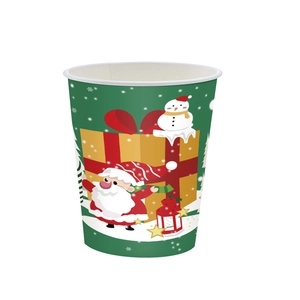 Close-up of a festive green Christmas paper cup with Santa Claus and snowman patterns