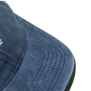 Detailed close-up of stitching on a navy washed cotton Easter baseball hat visor