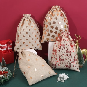 Christmas burlap drawstring gift bags with star, heart and deer prints on white steps