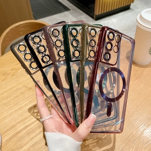 Five colored electroplated MagSafe phone cases held in hand over a wooden cafe table