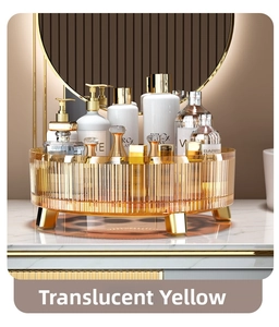 Detail view of amber rotating cosmetic organizer with gold legs on marble surface