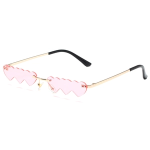 Trendy heart-shaped sunglasses with pink lenses and gold metal frames for party wear