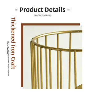 Detail of hand-welded thickened golden iron wire frame showing sturdy metal construction