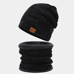 Close-up detail of thick black knit beanie and neck warmer set with warm grey fleece lining