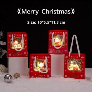 Detailed view of red lantern Christmas lantern with Santa and snowman scene, size 10x5.5x11.3cm