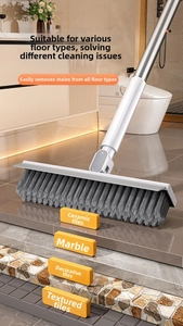 Detail of adjustable long-handle brush with dense bristles for tiles and hard floors