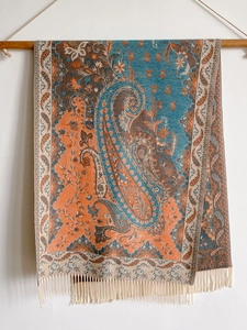 Detailed paisley pattern and tassel texture on ethnic cashmere-feel scarf and shawl