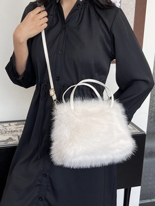 Plush white faux fox fur crossbody bag with thin leather shoulder straps for women