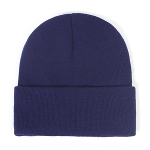 Detailed view of dark blue knitted beanie with ribbed texture and folded cuff design