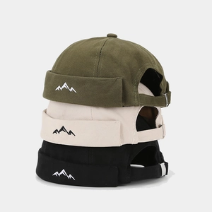 Three Miki Hats in army green, cream and black with mountain embroidery detail