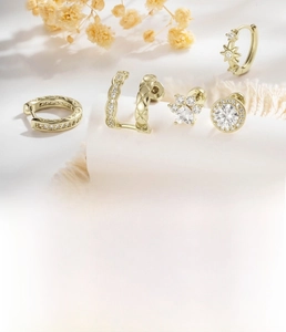 Detailed view of light luxury cartilage stud earrings set with zircon in light coffee gold