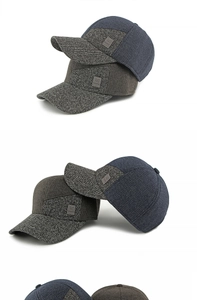 Detailansicht der Tweed-Einsätze und des Leder-Logos auf den Winter-Baseballkappen