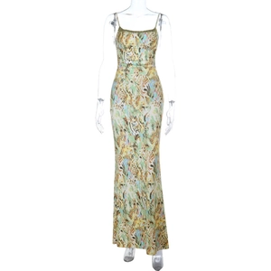 Detailed close-up of a slim-strap floral maxi dress with vibrant yellow and blue prints