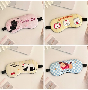 Detail view of 19x9cm cartoon sleep masks with blue cooling gel packs for eye fatigue relief