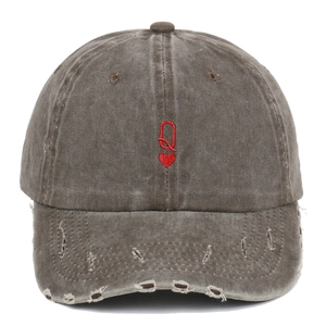 Distressed washed vintage baseball cap with red Q heart embroidery and worn brim details