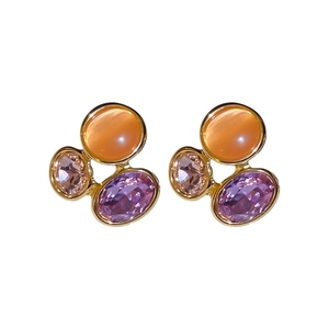 Vintage gold oval earrings with orange cat eye stone and purple faceted crystals