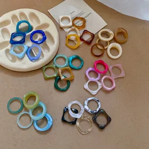 Five-piece colorful acrylic resin ring set with marble textures and gold foil accents