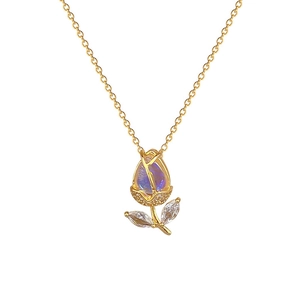 Elegant gold tulip necklace with blue-purple crystal pendant and marquise-cut gems