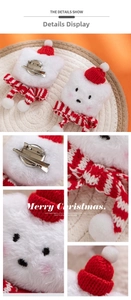 Detail of Christmas plush cat head pin with red knitted hat and striped scarf