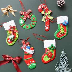 Christmas ornaments set with clay bows, stockings, wreaths, and candy canes for tree decor