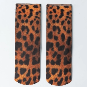 Flat lay of leopard print ankle socks showing detailed pattern and breathable fabric