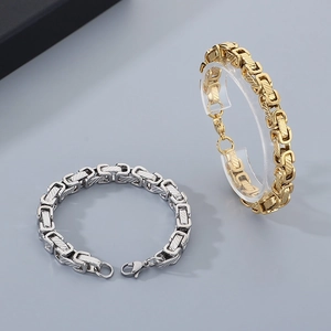 Detail of Byzantine style steel bracelets in gold and silver with intricate textures